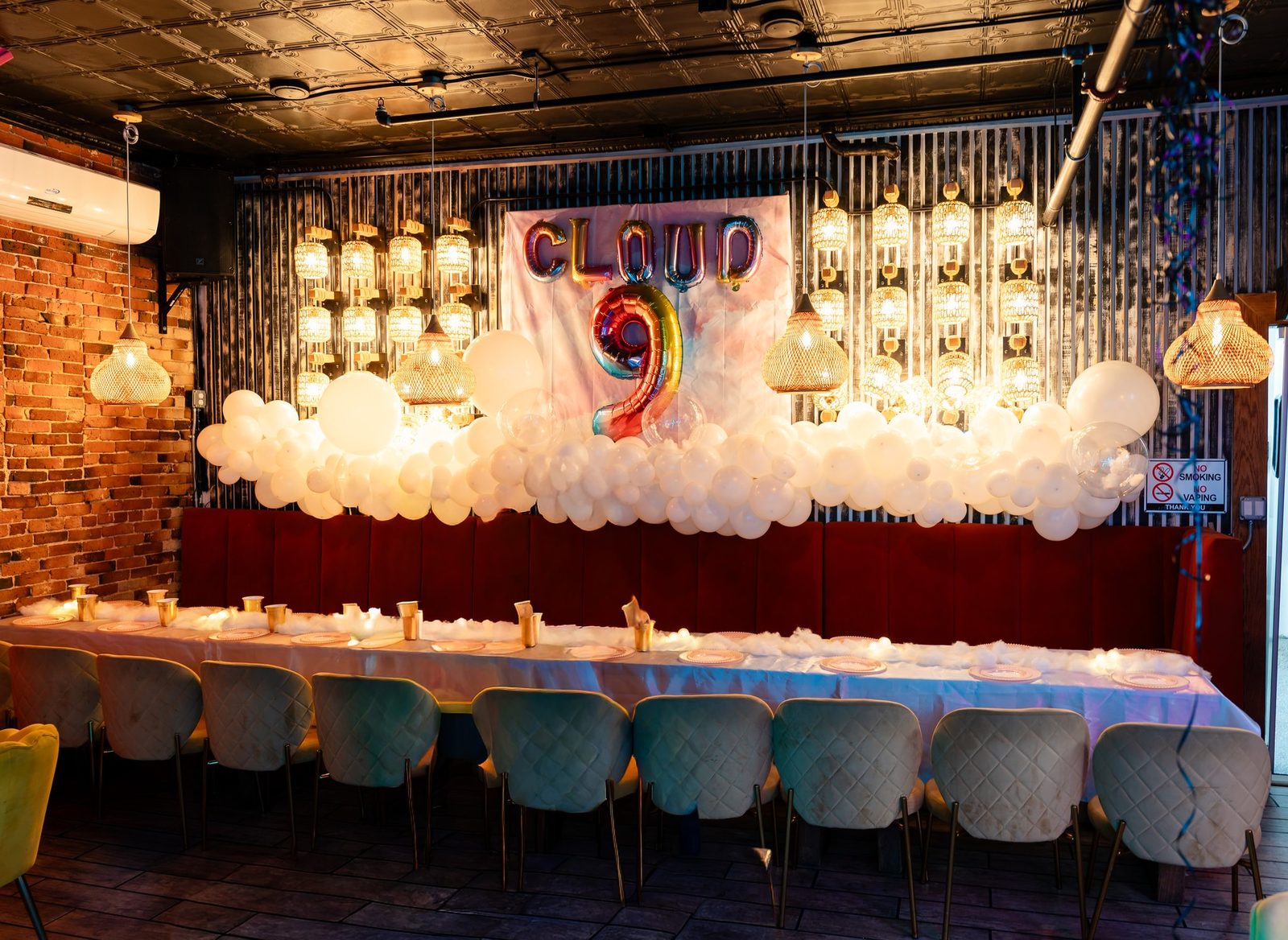 Wide view of the decorated brunch room and long table