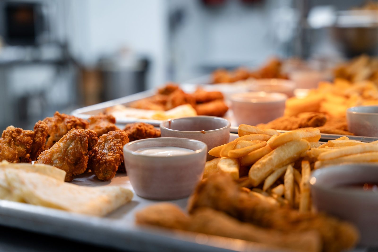 Brunch spread of wings, fries and dips