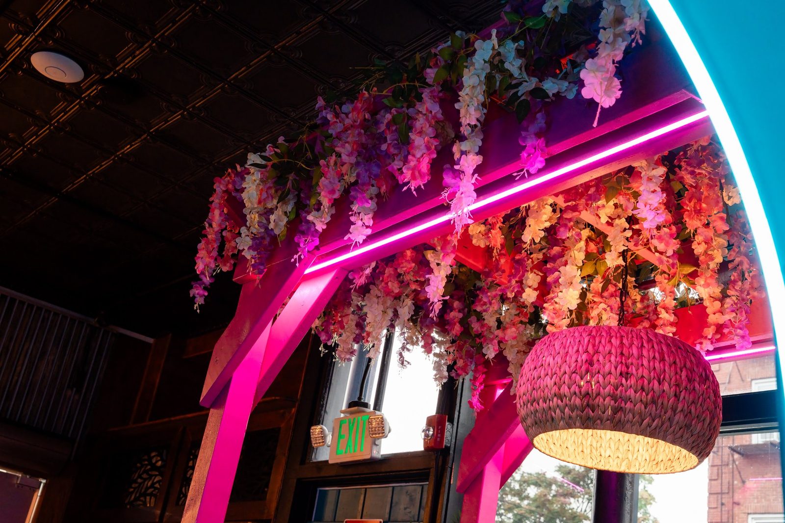 Floral arch with pink neon light